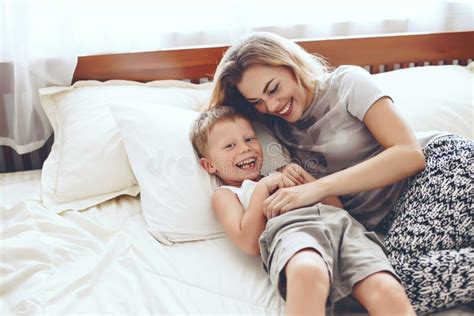 Mother And Son Playing Together In Bed stock videos and footage